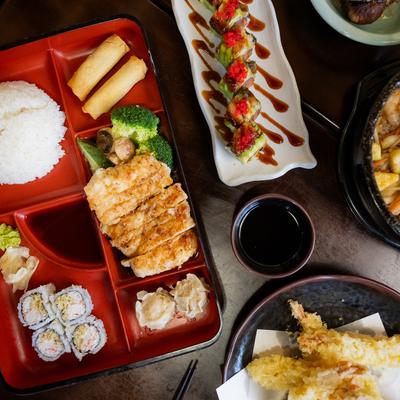 An assortment of food dishes displayed on a table, overhead view.