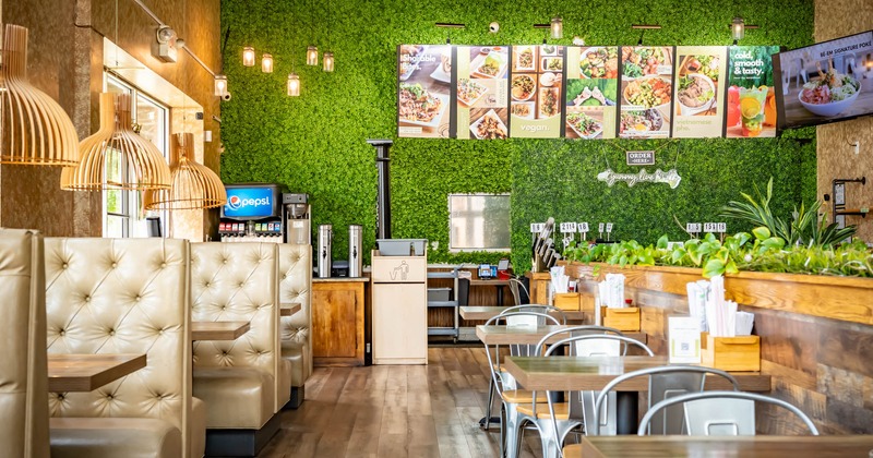 Interior, booths, tables, chairs, and plant decorations