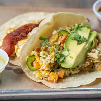 Breakfast tacos with bacon, eggs, avocado, and jalapeno.