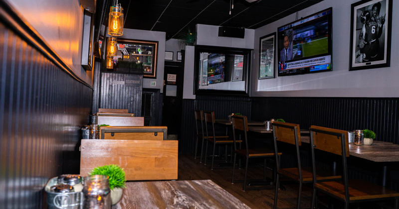 Restaurant Interior - tables and chairs, discreet light, pictures on the walls