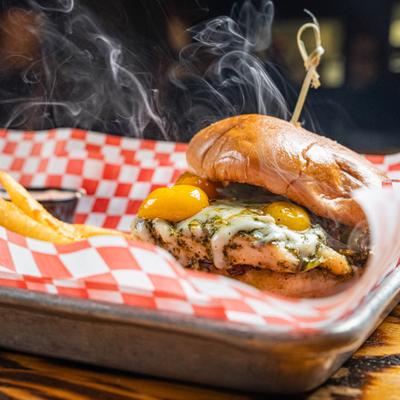 Pesto Chicken sandwich with steam visibly rising from it.