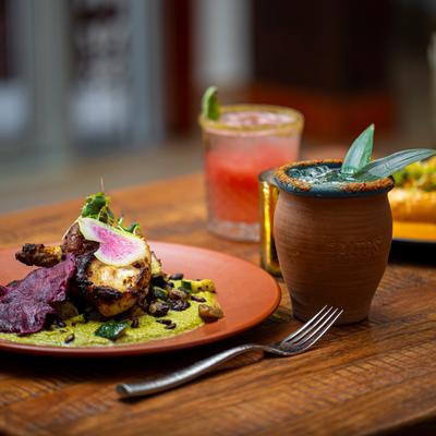 A meal and drinks on the table, angled view.