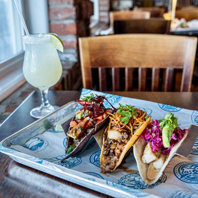 Different tacos served on the table.