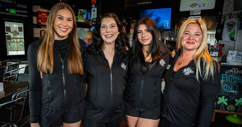 Employee holding menus