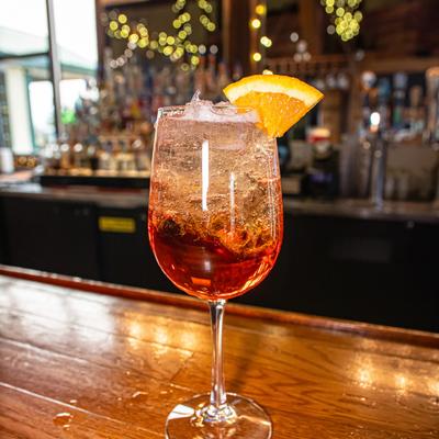 Aperol Spritz garnished with a slice of orange.