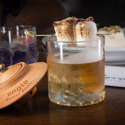 Campfire Old Fashioned garnished with toasted marshmallows.