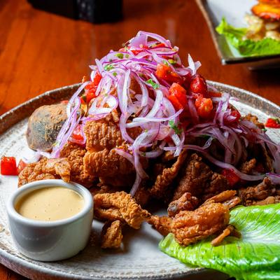 Breaded deep fried seafood served with yucca and criolla sauce.