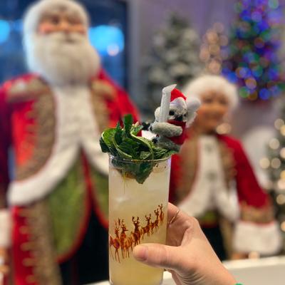 A hand holding a cocktail