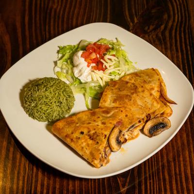 Mushroom quesadilla, served, top view.