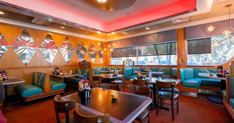Interior, dining area, classic diner seating booths, regular tables with chairs in the middle