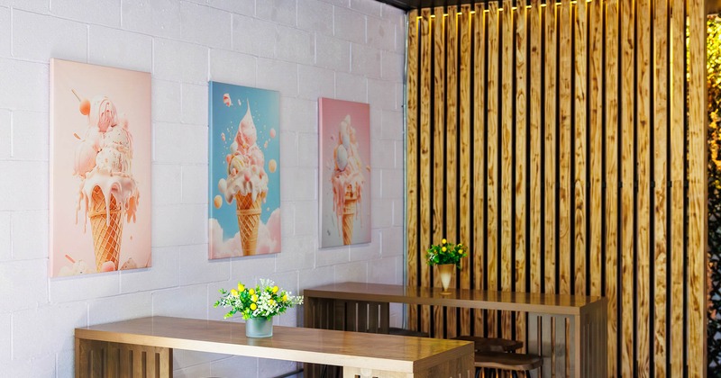 Modern cafe interior with wooden tables and stools
