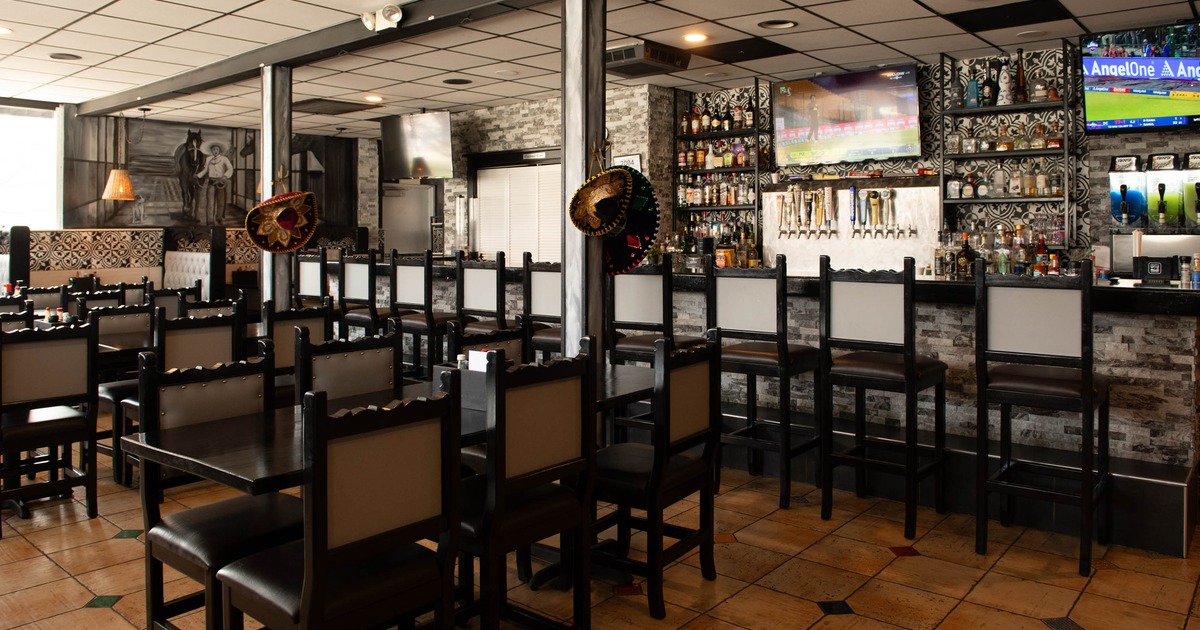 Interior seating area with tables and chairs