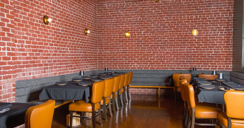 Dining space with brick walls, tables and chairs