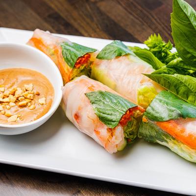 Shrimp summer rolls served with peanut sauce.