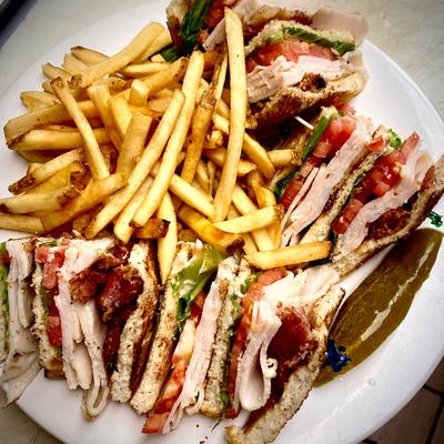Triple Decker Club sandwiches, and fries.