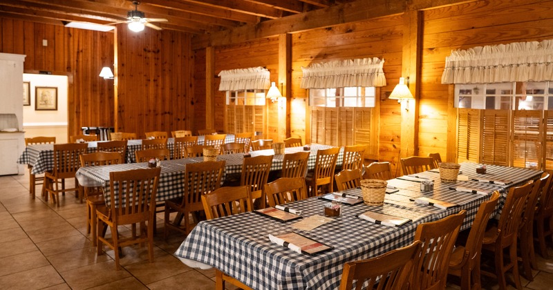 Cozy interior dining area with dining tables set for guests