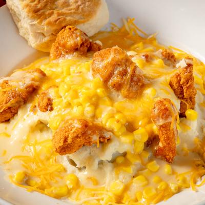 Juicy boneless chicken wings, mashed potatoes, sweet corn, chicken gravy, cheddar and monterey jack cheese