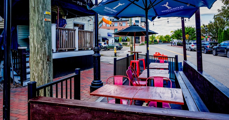 Exterior, side walk patio, tables, chairs, parasols