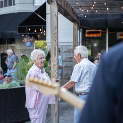 Exterior, live music, guests.