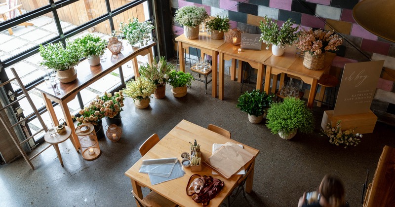 Pots with flowers on floor and tables