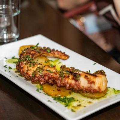Grilled octopus, potatoes, chimichurri sauce.