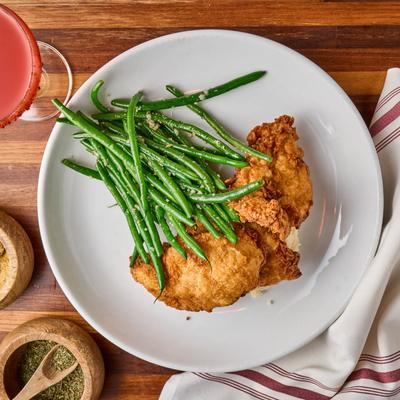 Southern Fried Chicken, served with mashed potatoes, and green beans.