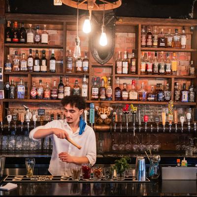 Bartender making drinks.