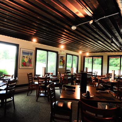 Restaurant's interior with tables and chairs.