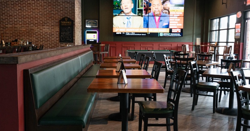 Interior, seating area, a large TV screen on the wall