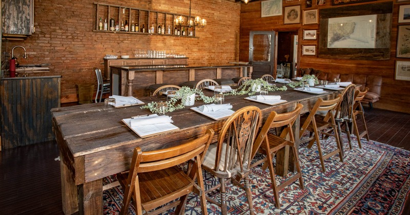 Interior, rustic table with wooden chairs