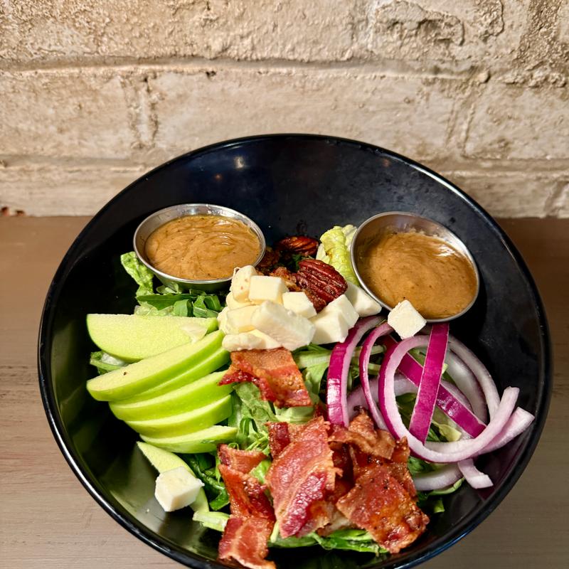 Autumn Seasonal Salad -  Romaine & Arugula mix, an autumn vinaigrette, red onions , fresh mozzarella, candied bacon, candied pecans, and green apple slices.  Add Chicken $5 photo