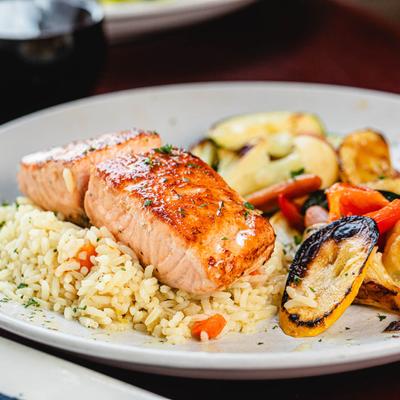 Grilled salmon with rice and mixed vegetables.