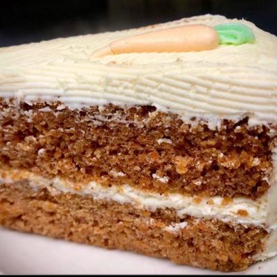 Carrot Cake topped with cream cheese frosting.