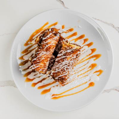 Churro french toast drizzled with caramel.