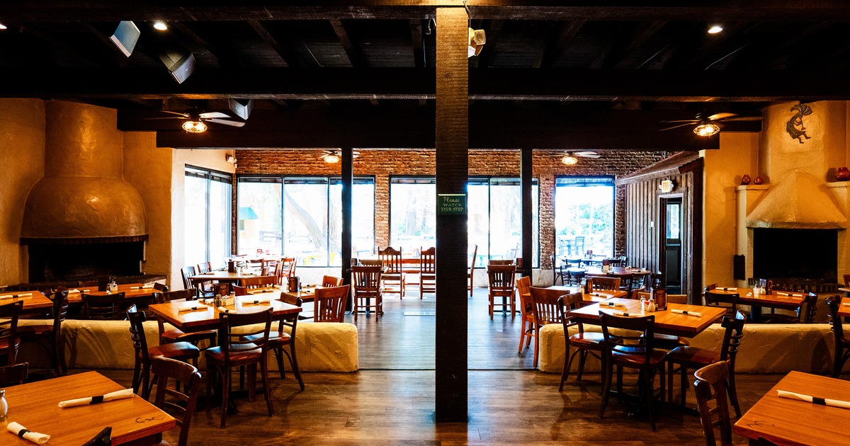 Spacious and cozy interior dining area with set dining tables