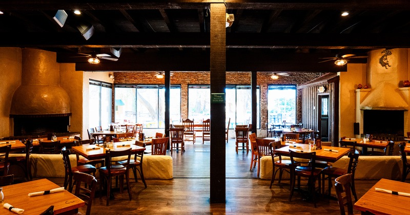 Spacious and cozy interior dining area with set dining tables