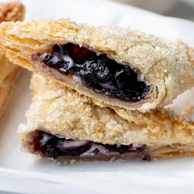 Blueberry empanadas with cream cheese.