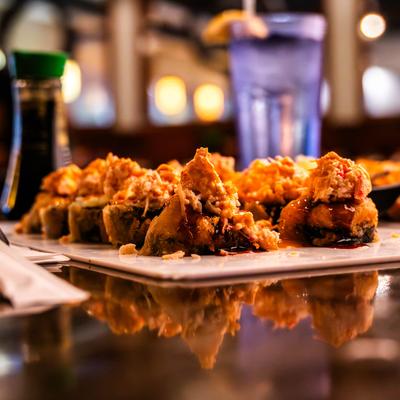 Volcano Rolls, with tuna, cream cheese, avocado, crab sticks, and snow crab salad.