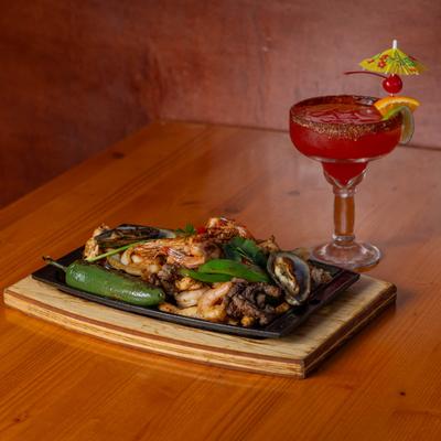 Mixed food platter with chicken, shrimp, beef, pork, peppers, and jalapeno.