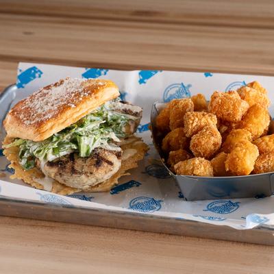 Grilled Chicken Caesar Sandwich and tater tots.