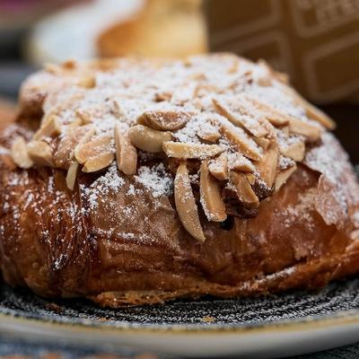 Scone topped with peanuts and powdered sugar