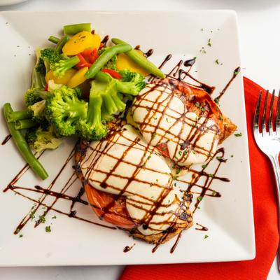 Chicken caprese sandwich with mixed veggies and balsamic drizzle