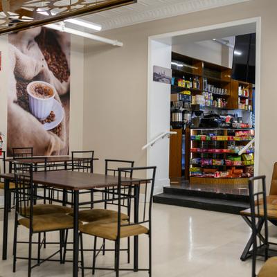 Interior with indoor seating and a connected convenience section.