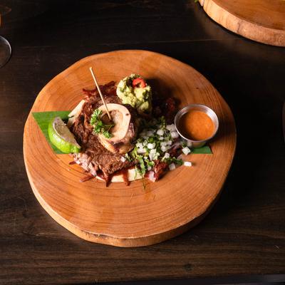 Grilled ribeye, with bone marrow, cheese crust, and flour tortilla.