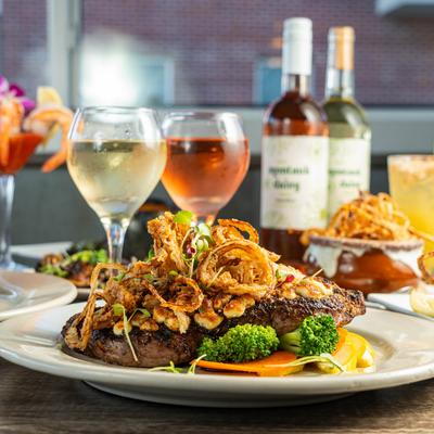 Chargrilled New York Strip steak, with crispy onions and veggies.