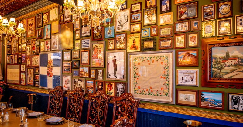 Diner table and chairs, wall with paintings