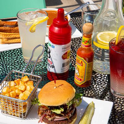 Burger, fries, sauces and cocktails
