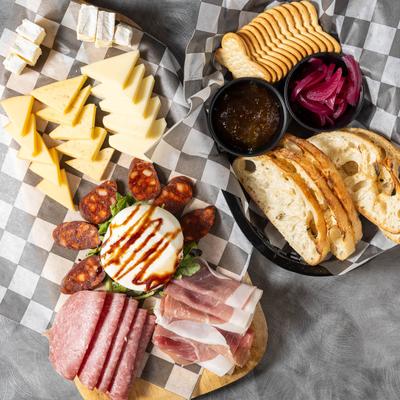 Charcuterie and cheese , served with  bread, crackers, jam, pickled red onions.