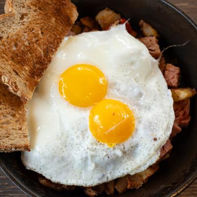 Corned beef hash, topped with fried eggs.