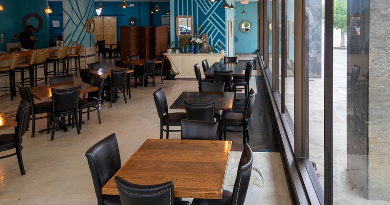 Interior, tables and chairs near the windows